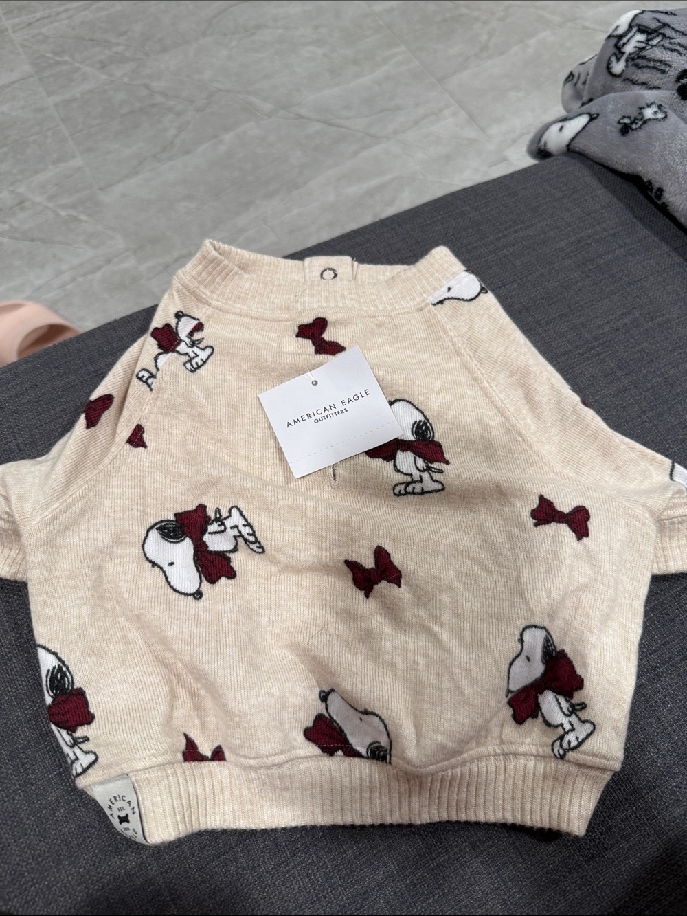 American Eagle Outfitters Cream Knit Sweater with Snoopy and Maroon Bows